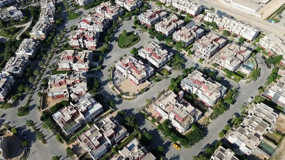 Reem Residence — aerial render of the 56-feddan master plan showing villa clusters and green spaces in 6th of October